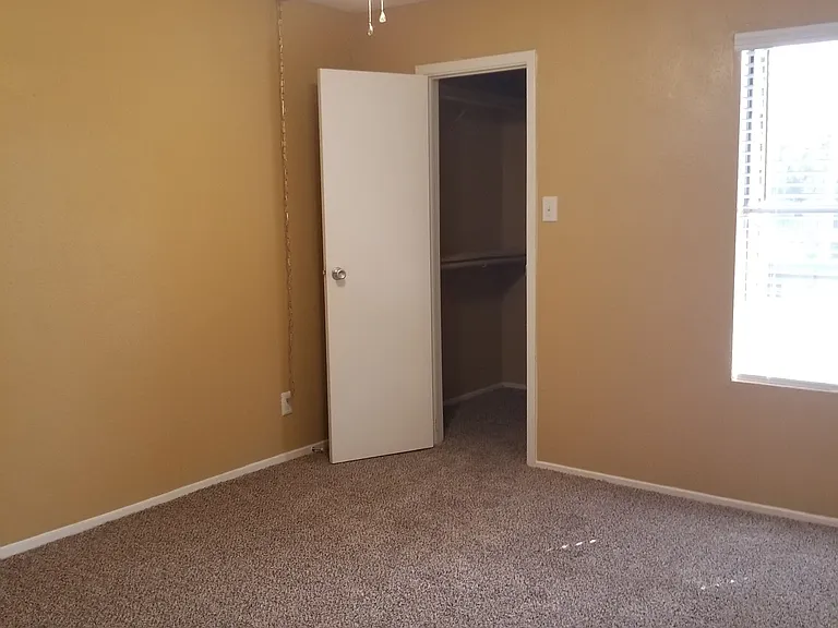 Spare bedroom with large walk in closet