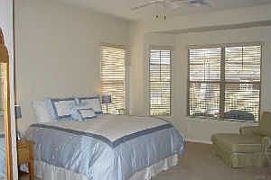 Large Bedroom With a Bay Window Views of the City and the Mountains