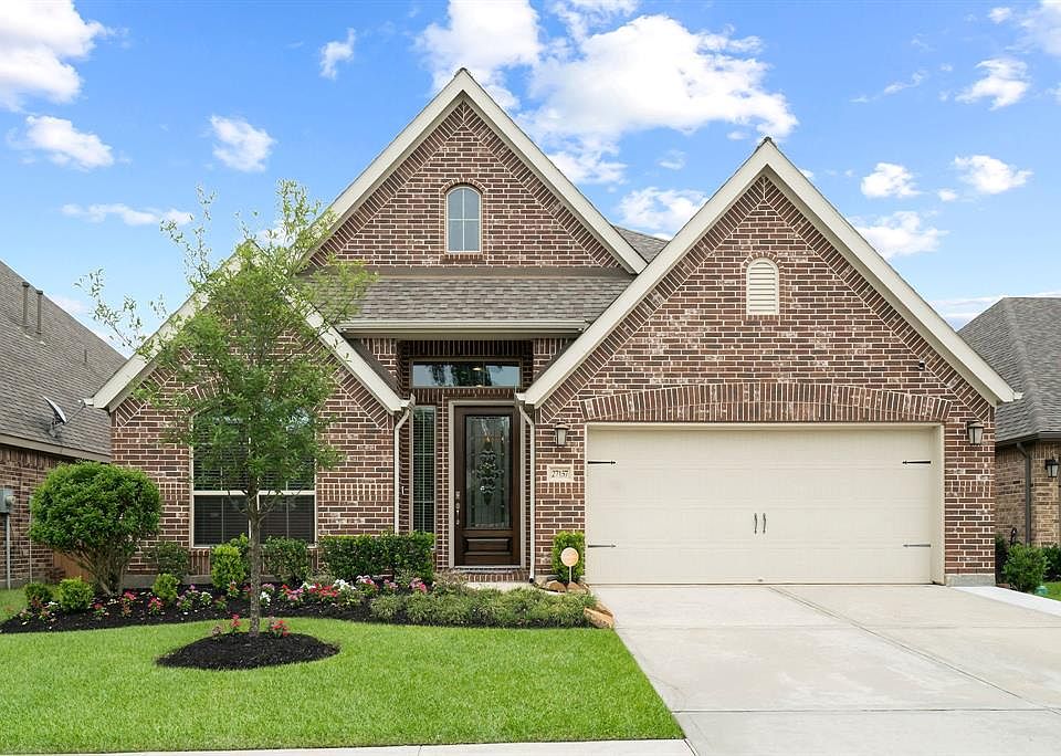 Welcome to 27157 Devyn Forest Lane in the master planned community of Harmony!
