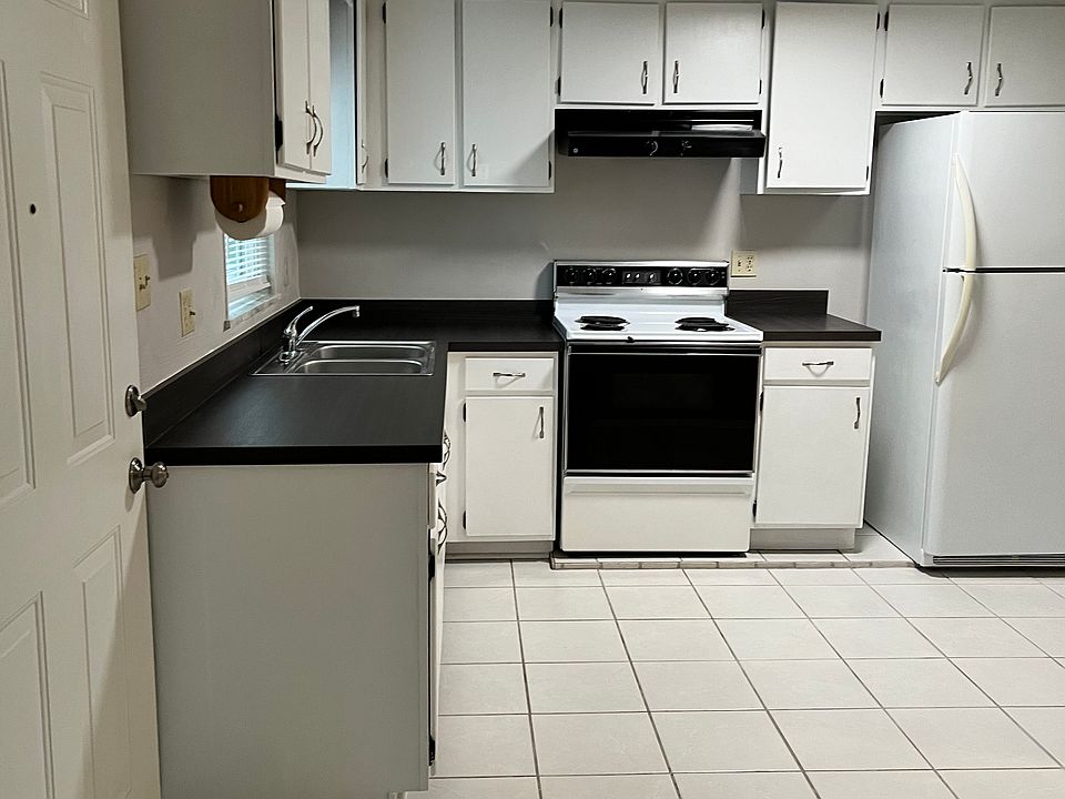 Kitchen. Front door to left of photo