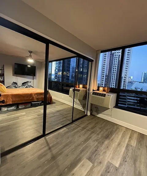 large wall to wall closet, large cold AC unit, windows open for cool breezes, blackout curtains for sleeping in
