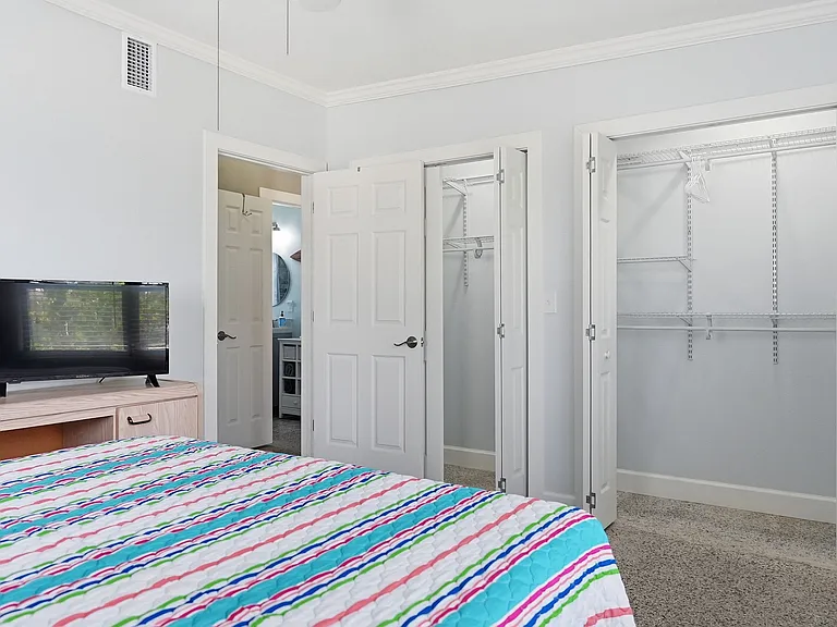 Bedroom #1 with Queen Bed and lots of closet space and 42 inch TV.