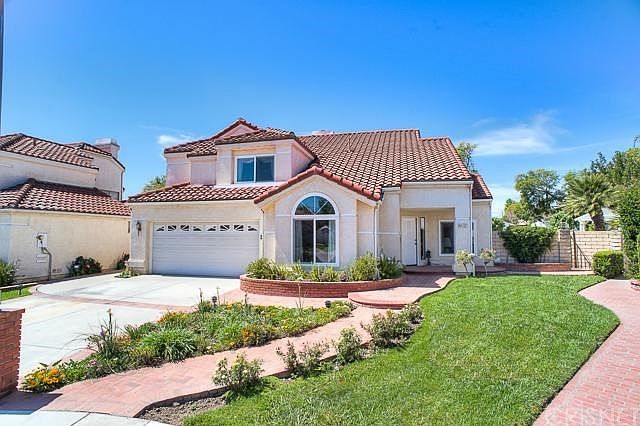 Charming La Villanueva two story home built in 1987 four bedroom, three bathroom, 2,235 square feet of living space, 7,513 square foot lot, dual pane windows, handsome brick hardscaping, two car attached garage with direct access into the home.