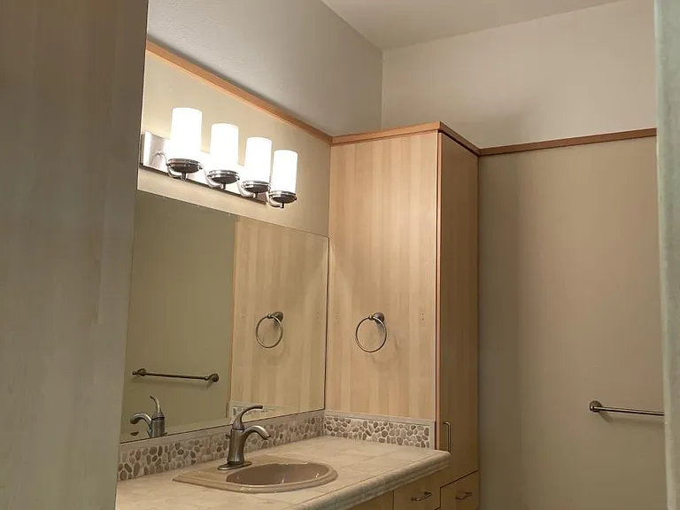 High Ceilings and bathroom fan, upgrade tile countertops and lighting, and lots of storage