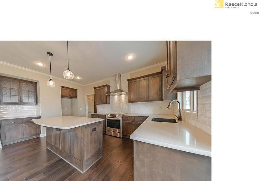 Kitchen includes: Granite counter tops, Kholer oil rubbed bronze kitchen faucet with integral sprayer, Bosch stainless steel appliances: range, dishwasher, microwave. Concealed cabinet door hinges, Soft-close drawers with designer pulls, and USB charging 