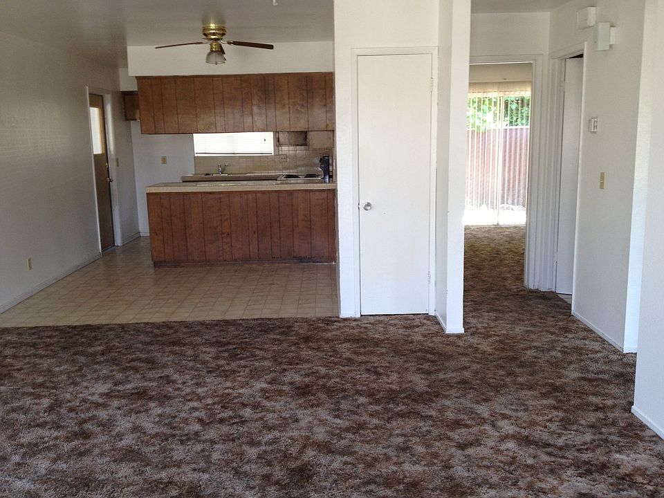 living room front front door entry to kicthen garage to left