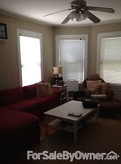 Den : Cozy, roomy, 3 huge windows, extra-large closet, hardwood floors throughout.
