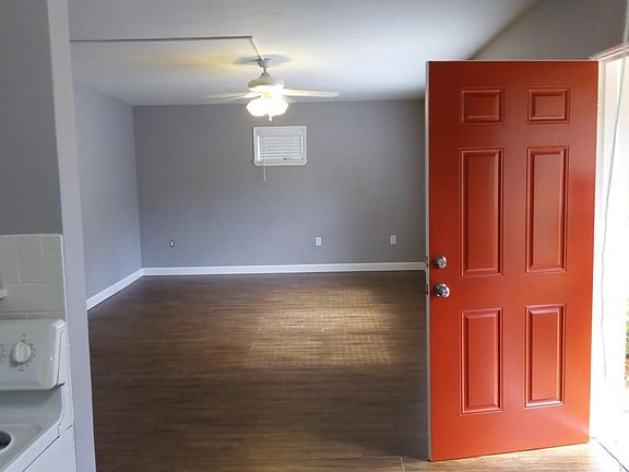 Living Room with Front Door Opened