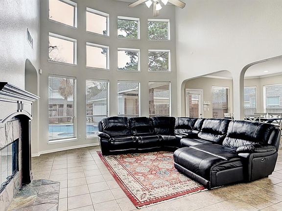 Two story ceiling and stunning wall of windows brings in great sunlight. Spacious and light filled family room is open to the kitchen and breakfast room.