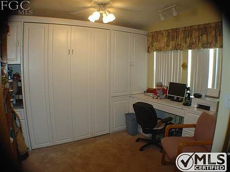 Queen Murphy bed, built in computer station, file drawers and storage.