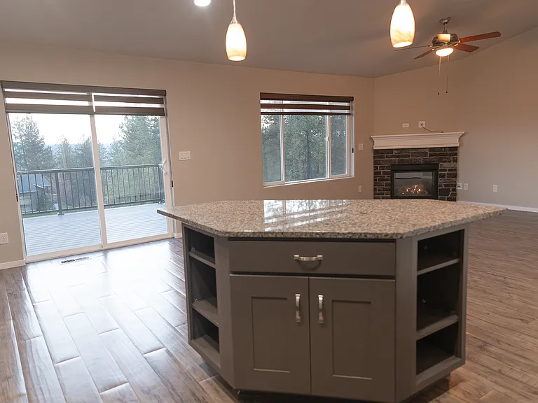 Granite island countertop. Fits 2 bar stools. Large living room for entertainment.