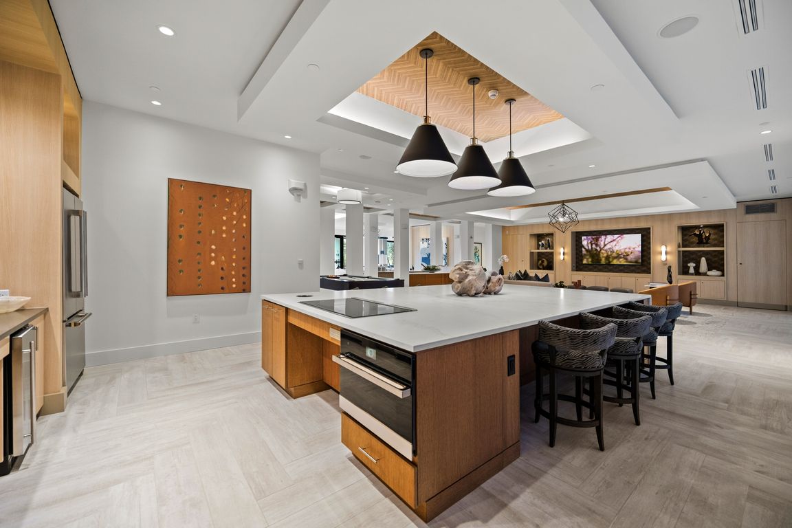 Entertaining kitchen and social lounge, outfitted with a suite of premium appliances