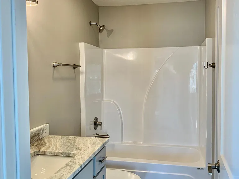Full bathroom with tub/shower combination in en-suite bathroom off the master bedroom
