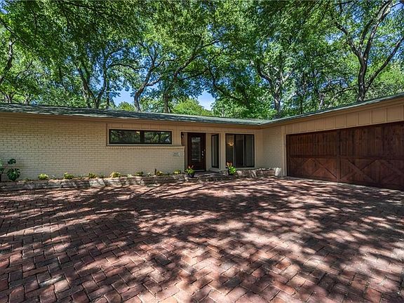 The charming brick driveway has wonderful curb appeal.