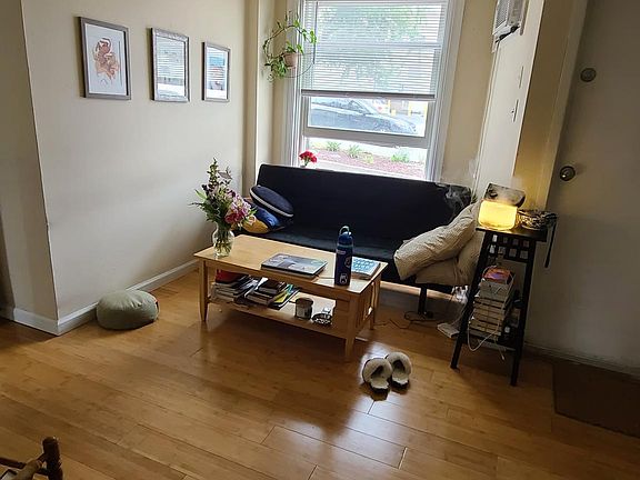 Comfortable living room area with hardwood floors throughout