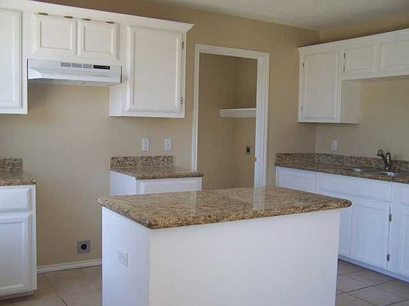 Large kitchen with granite counter tops