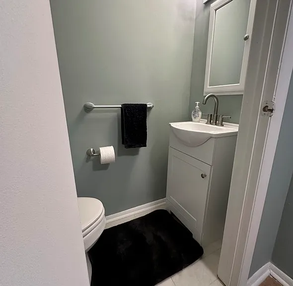 Basement 1/2 bath with new vanity and toilet