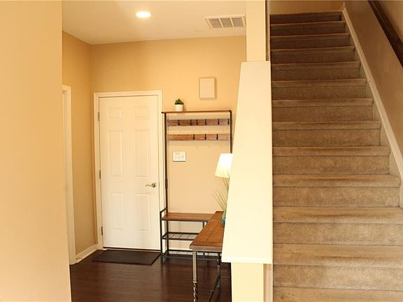 Foyer with hardwood floors
