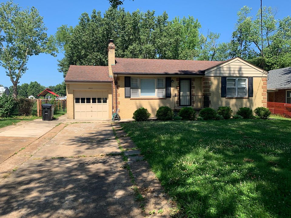 Front of Home, large double driveway, single-car garage