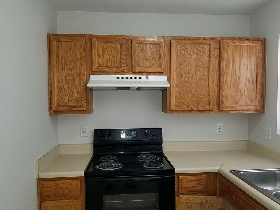 Oak Cabinets, Black appliances open Kitchen Dishwasher