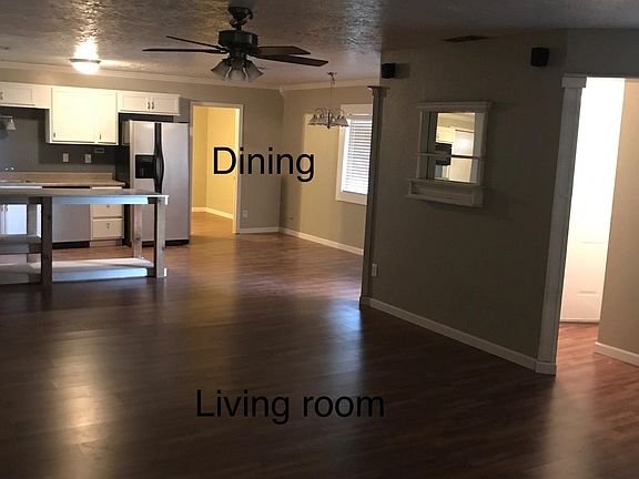Living room, dining room, kitchen, bedroom 3, and entry view