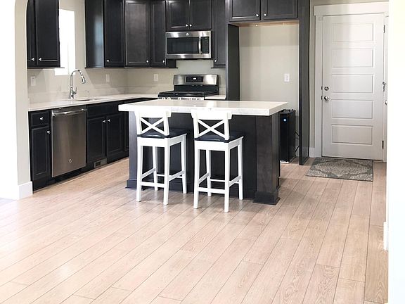 Maple cabinets with soft closing doors, quarts countertops and large sink..