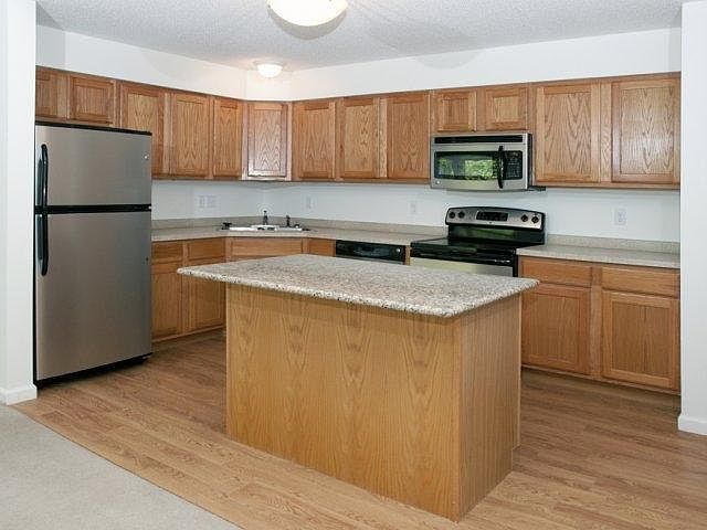 Open Concept Kitchen with Granite Island