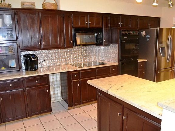 Granite counters and tin back splash.