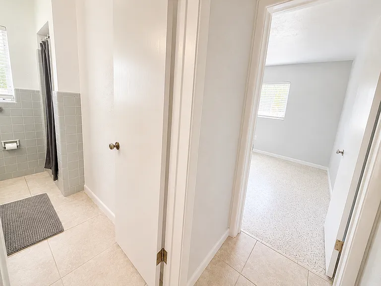Hallway to bedroom #3 and bathroom #2 (split plan; two bedrooms and bathroom on the other side of the house).
