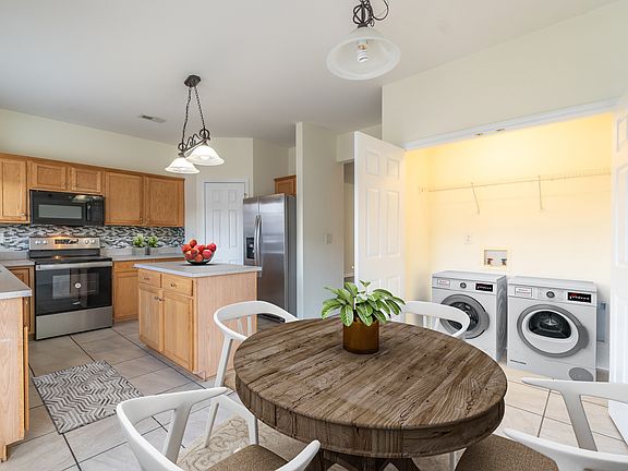 Virtual staged casual dining. Deck extends from this room. W/D not included