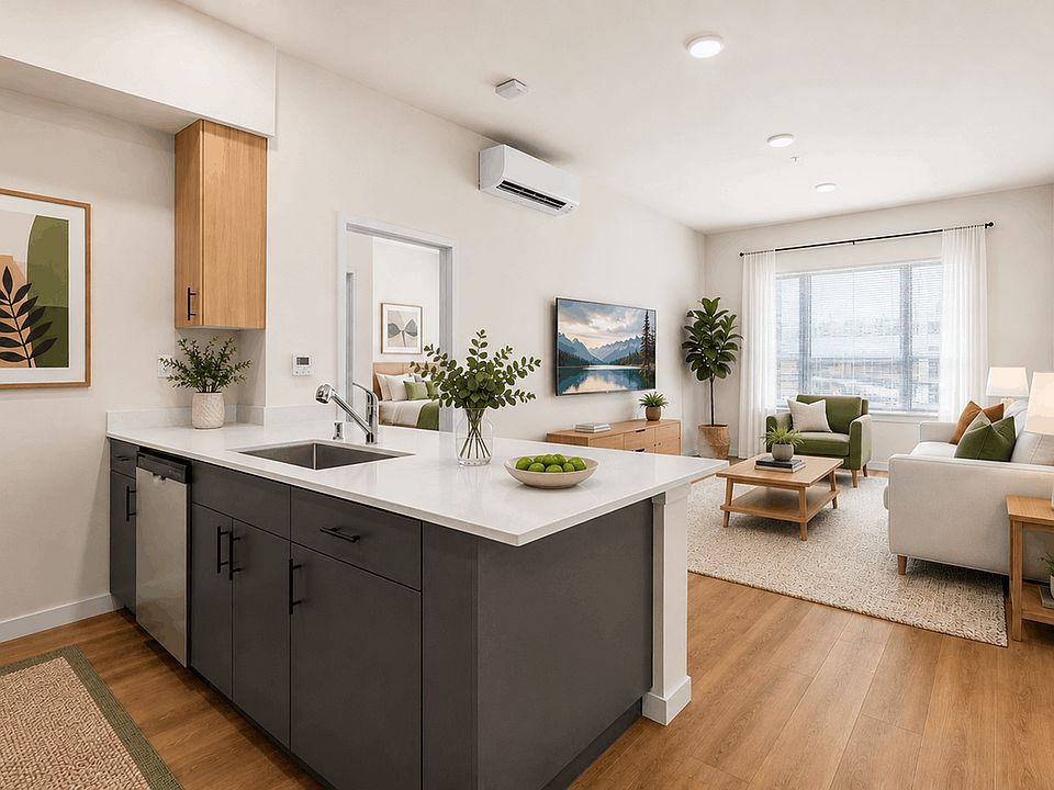 Open-concept 2-bedroom apartment with quartz countertops, modern finishes, and spacious living areas at 27 West Apartments.