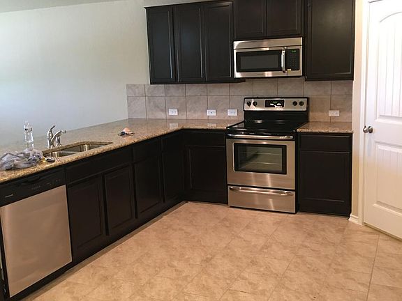 Kitchen before the walls were painted.