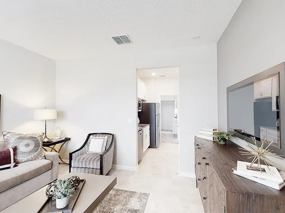 The private suite includes a separate entrance off the front porch, living area, kitchenette, bedroom, bathroom and laundry