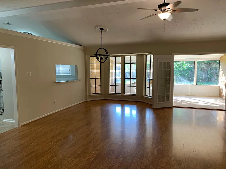 Vaulted ceilings. Laminate flooring. Kitchen is to the left