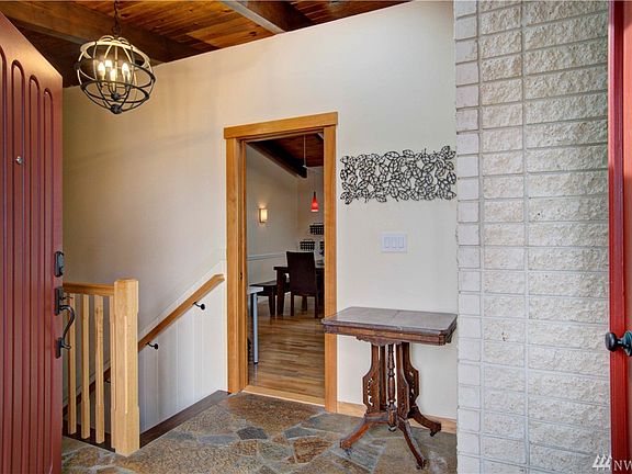 A look into the entryway with the eat-in kitchen beyond.
