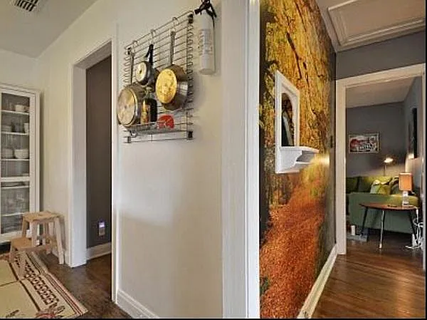 View looking down bedroom hallway and left into the kitchen.