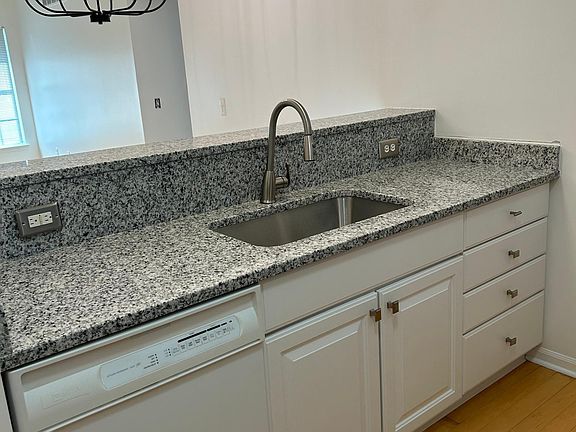 Other side of Galley Kitchen open to dining/living area - bar height bar