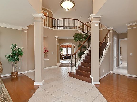  Grand two story entry with wrought iron staircase!