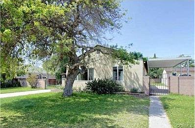 Mature tree affords wonderful shade that keeps the front of the