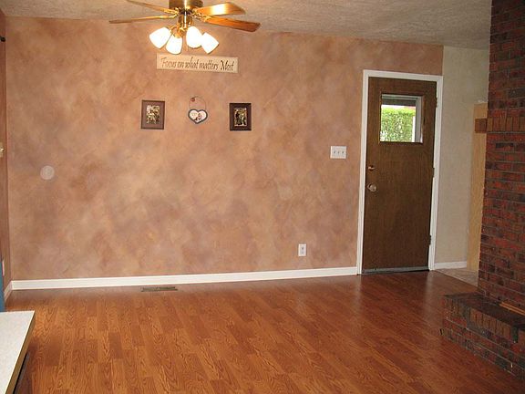 Dining area with brick fireplace