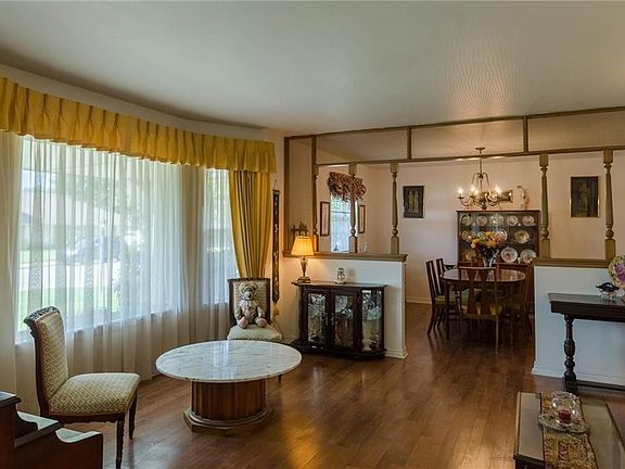 Formal Living room with bay window - this house had new vinyl windows put in in 2010.  Pergo floors run through the living room and dining area.