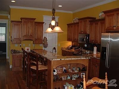 Ample cabinets, hardwood floors