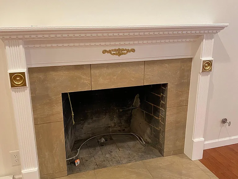 Tres chic fireplace. Gas insert will be added before move-in date.