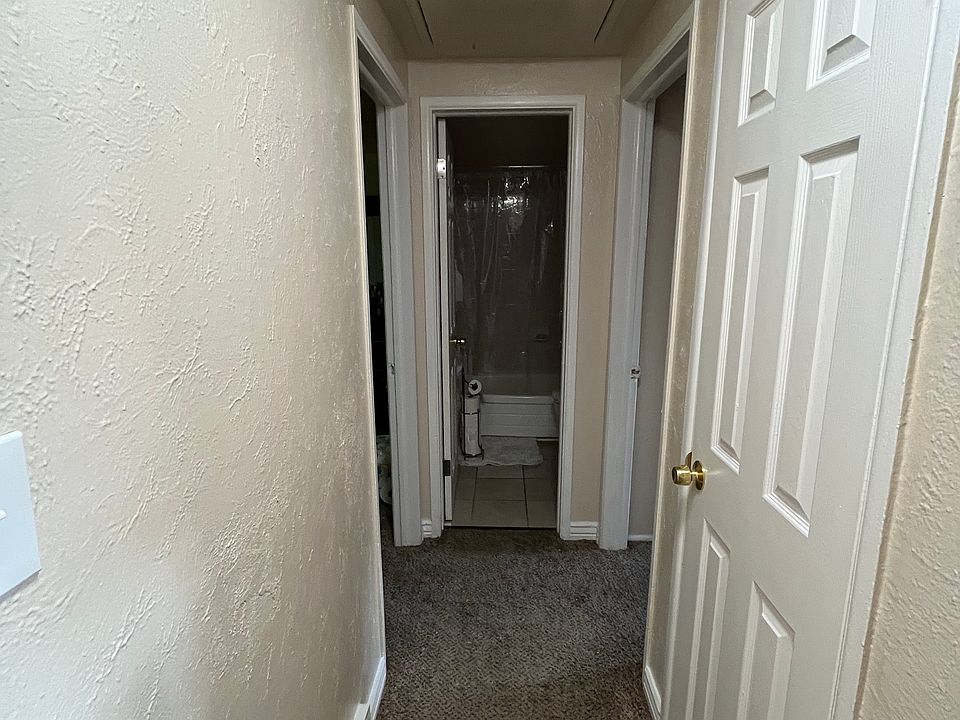 Hallway to bedrooms and bathroom at end of hall