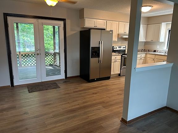 Walking past the fireplace and through the dinette area you can feel just how Open this Floor Plan really is. And, you can see the Screened Porch is right off the kitchen making for an alternative area for meals.