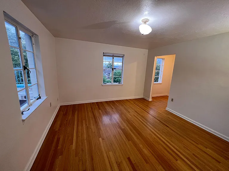 Master bedroom has bonus space in corner.