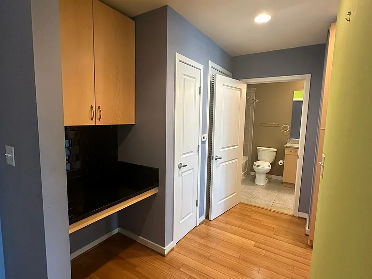 Small desk and closet next to it