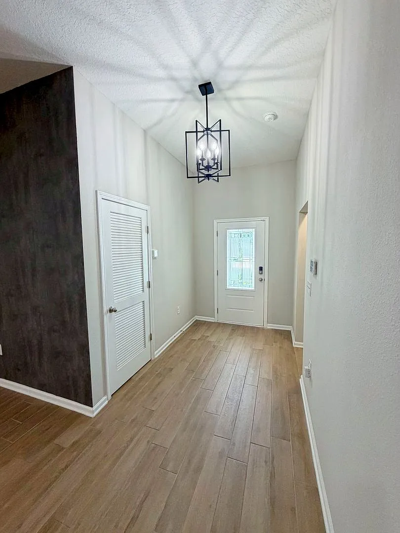 Spacious 4-bedroom, 2-bathroom home featuring an open-concept floor plan and a comfortable, moder... — Photo 3
