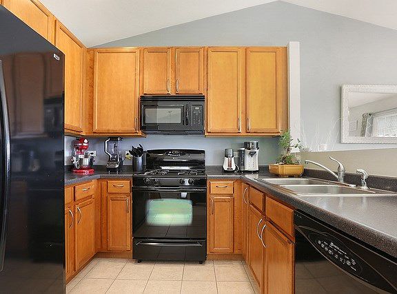 The kitchen is completely open to the rest of the main living area- vaulted ceilings and plenty of s