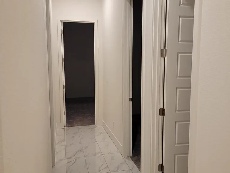 HALL VIEW OF SHARED BATH & BEDROOM ON RIGHT, A BEDROOM FRONT OF HOME